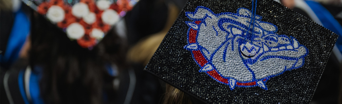 Zags show off their decorated mortar board at commencement