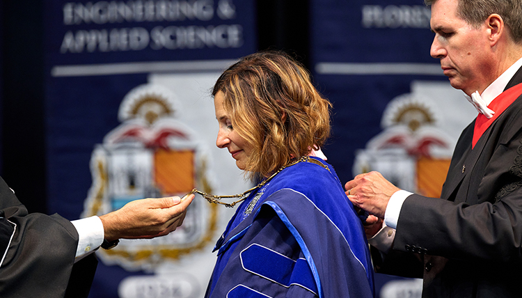 Passerini receives the chain of office at her inauguration. Passerini receives the chain of office at her inauguration.
