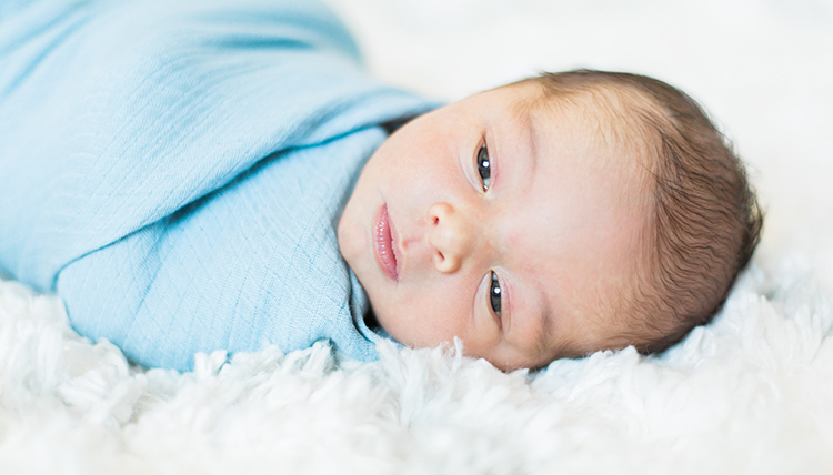 baby boy wrapped in blue blanket baby boy wrapped in blue blanket