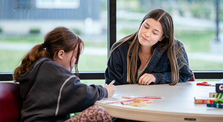 Gonzaga student works with a youth through CEL Gonzaga student works with a youth through CEL
