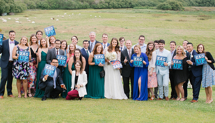 couple surrounded by lots of friends and Zag Up signs couple surrounded by lots of friends and Zag Up signs