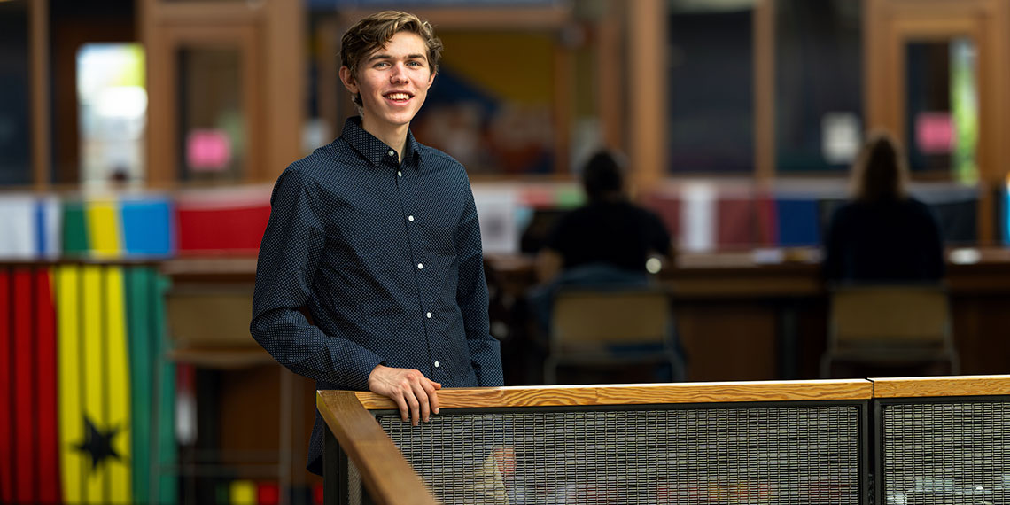 Reid Quiggins stands along a rail in Hemmingson Center