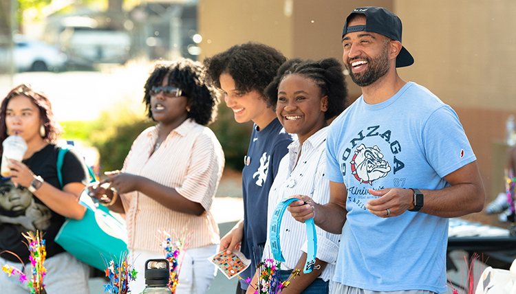 A group of smiling people at a block party