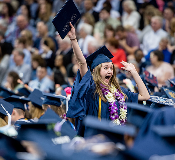 Undergraduate Student Celebrating in Crowd