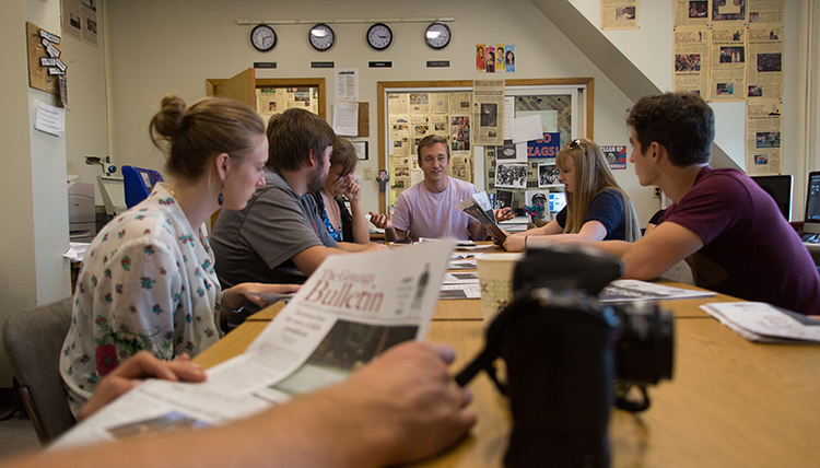Gonzaga University Integrated Media Journalism Students around a table Gonzaga University Integrated Media Journalism Students around a table