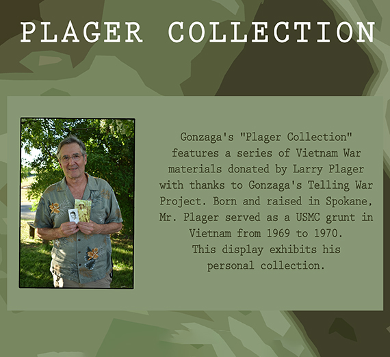 Group photo of Larry Plager and the Telling War group gathered around a bookcase with a collection of Vietnam war books. Group photo of Larry Plager and the Telling War group gathered around a bookcase with a collection of Vietnam war books.