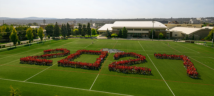 Students in red t-shirts line up to form a 2027 Students in red t-shirts line up to form a 2027
