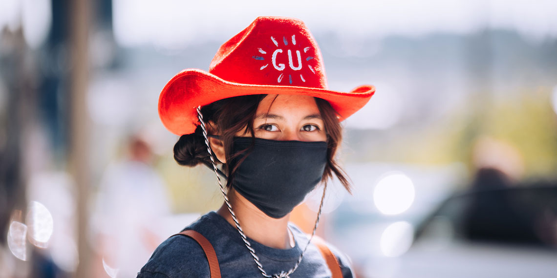 Student wearing Gonzaga march and a mask.