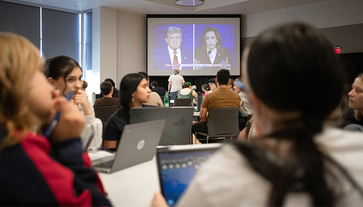 students watch the presidential debate on big screens students watch the presidential debate on big screens