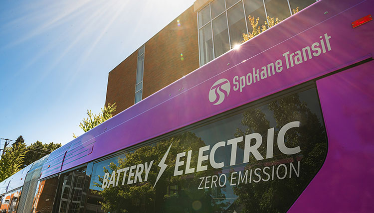 A Spokane Transit City Line bus with the words Battery Electric Zero Emission on the window A Spokane Transit City Line bus with the words Battery Electric Zero Emission on the window