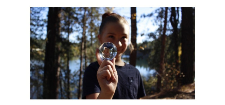 Photo of a person holding a bubble Photo of a person holding a bubble