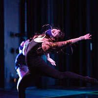 Dancer in movement on stage. Dancer in movement on stage.
