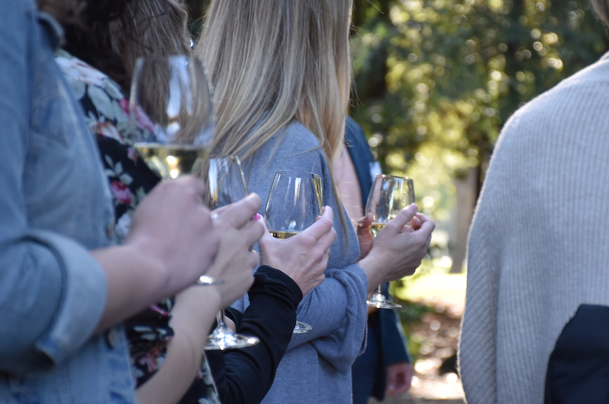 wine institute students holding wine glasses wine institute students holding wine glasses