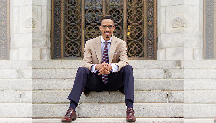 black professor in suit on steps black professor in suit on steps