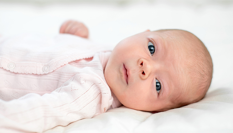 baby with bright blue eyes baby with bright blue eyes