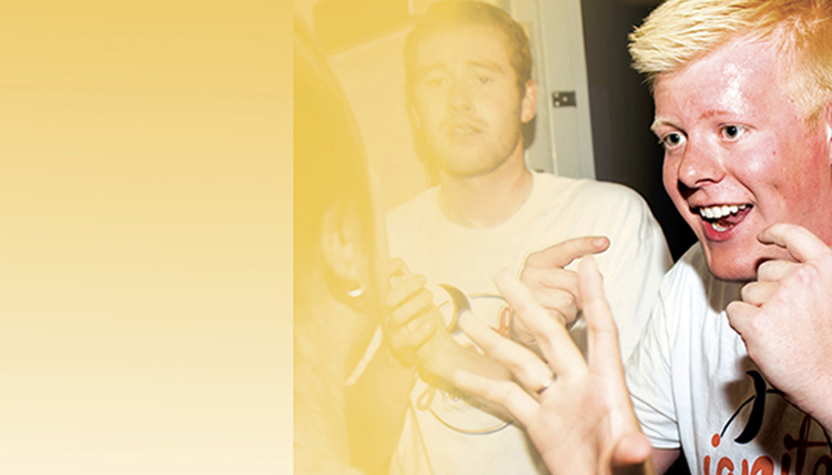 male student smiling with yellow treatment over image male student smiling with yellow treatment over image