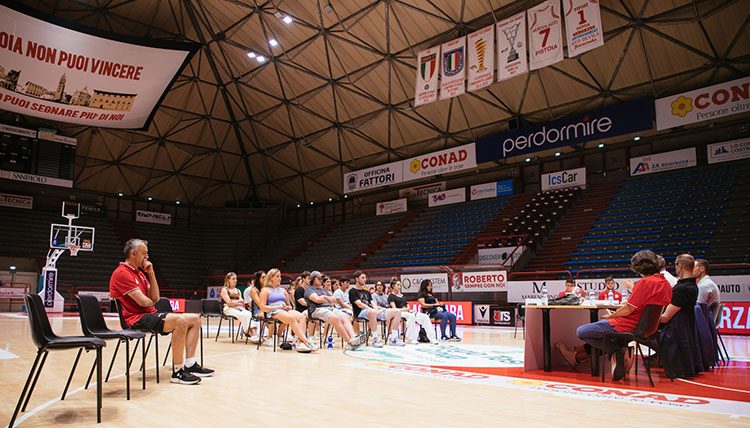 Gonzaga students sit on a basketball court floor in Italy Gonzaga students sit on a basketball court floor in Italy