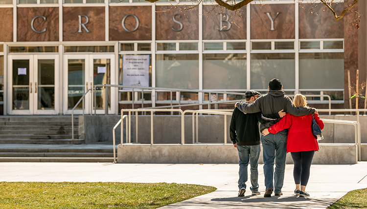 family walking by crosby center family walking by crosby center