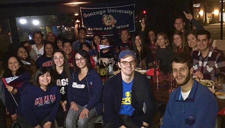 a group of LA gonzaga alumni gather at a bar to watch the Zags a group of LA gonzaga alumni gather at a bar to watch the Zags