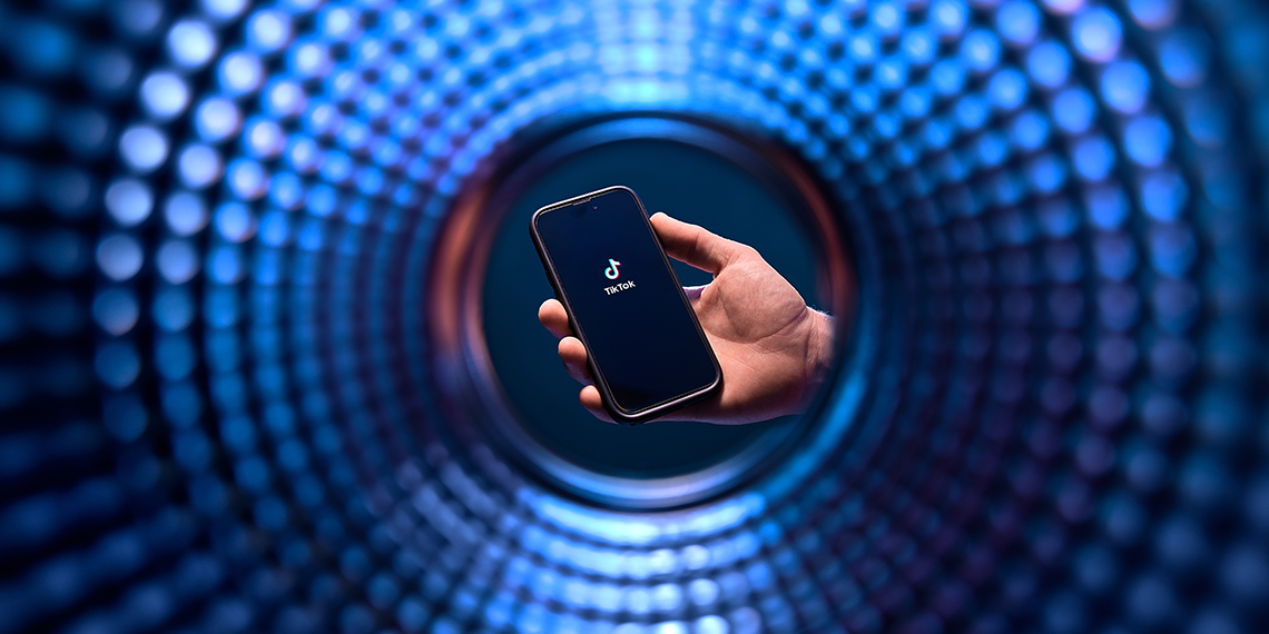 A phone inside a colorful swirl.