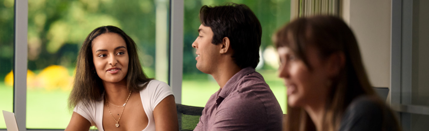 Students chatting in a classroom. 