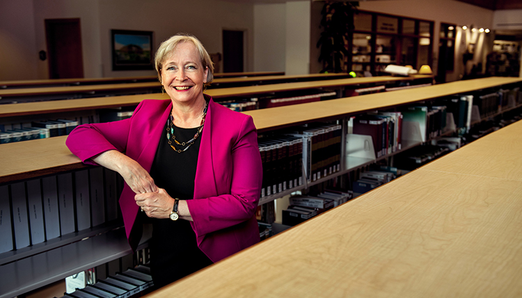 Professor Ann Murphy stands in Chastek Library at Gonzaga Law