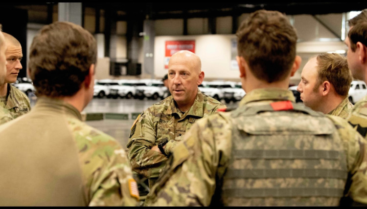 General Dan Dent leads his team. General Dan Dent leads his team.