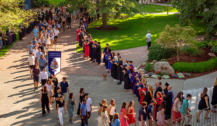 Professors in regalia line a path into St. Aloysius church Professors in regalia line a path into St. Aloysius church