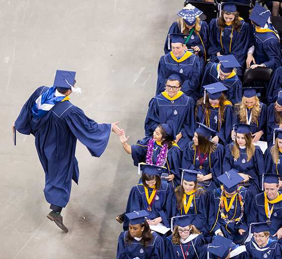 Two graduates slap a 