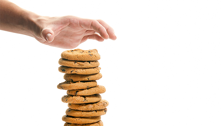 hand reaching for cookies hand reaching for cookies