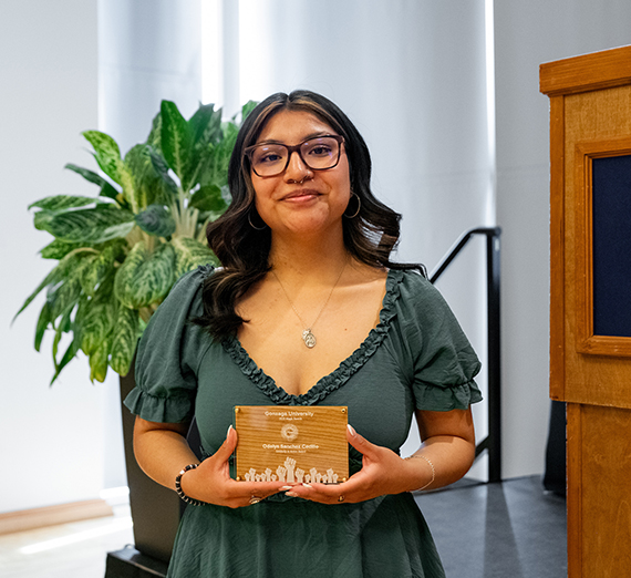 Odalys Sanchez Cedillo smiling and holding the Solidarity in Action Award at Gonzaga University's Magis Awards. Odalys Sanchez Cedillo smiling and holding the Solidarity in Action Award at Gonzaga University's Magis Awards.