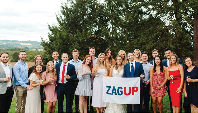 wedding couple and group of friends with zag up flag wedding couple and group of friends with zag up flag