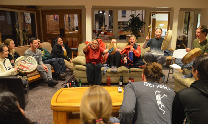 members of the Makah Tribe drum with Gonzaga students members of the Makah Tribe drum with Gonzaga students