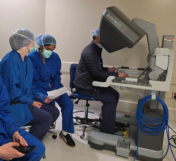 surgeon at console of a DaVinci robot