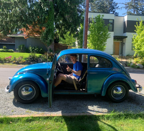 scholarship-jason-orr-car Jason Orr, class of 2020, in a Volkswagen bug car