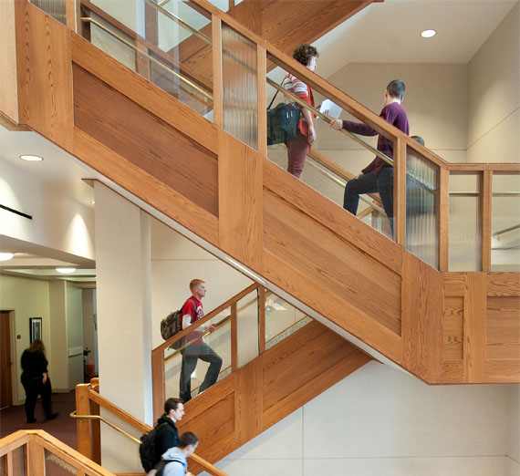 students walk up staircase in law school