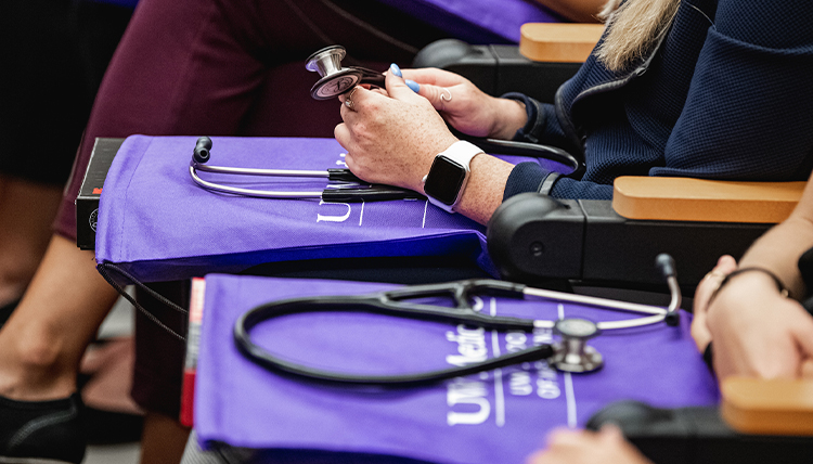 Health students of UW-GU health partnership with stethoscopes. Health students of UW-GU health partnership with stethoscopes.