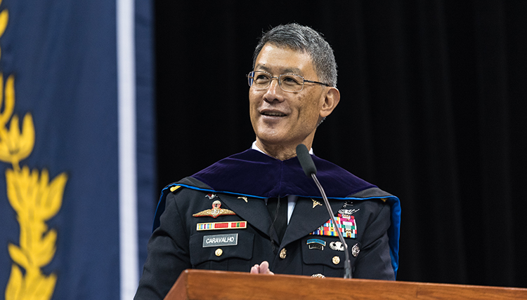 Joseph Caravalho in Army dress blues with markings of an officer, at the podium Joseph Caravalho in Army dress blues with markings of an officer, at the podium