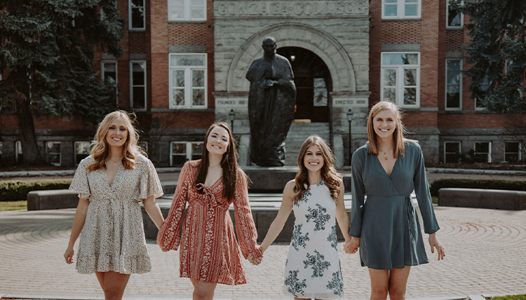 four girls in dresses in front of Gonzaga's College Hall four girls in dresses in front of Gonzaga's College Hall