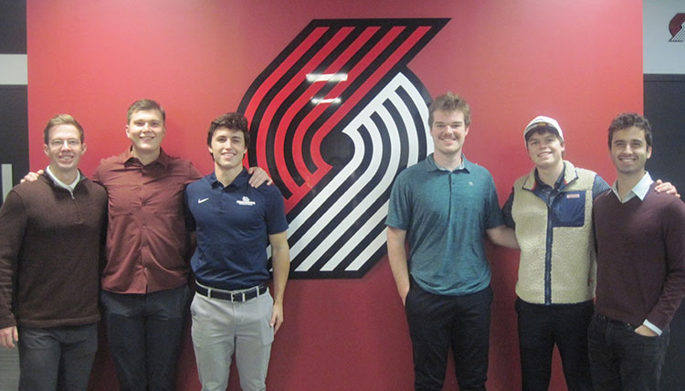 Six members of the Gonzaga Sports Consulting Group pose with the Portland Trailblazers logo Six members of the Gonzaga Sports Consulting Group pose with the Portland Trailblazers logo