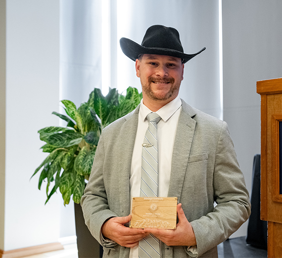 Holden Rupp smiling and holding the Jerome Nadal, S.J. Award at Gonzaga University's Magis Awards. Holden Rupp smiling and holding the Jerome Nadal, S.J. Award at Gonzaga University's Magis Awards.