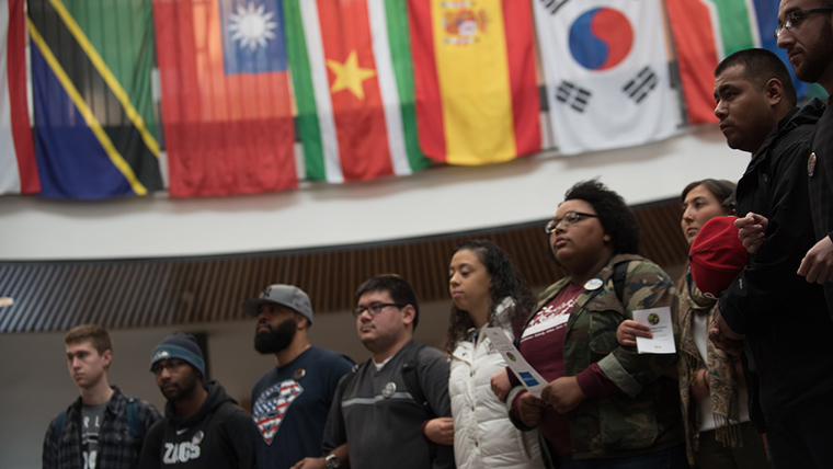 Students stand linked together in the Hemmingson Center. Students stand linked together in the Hemmingson Center.