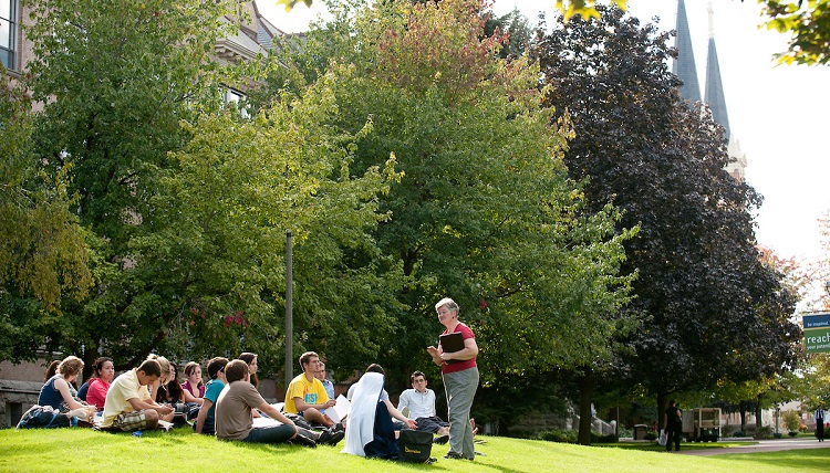 Students enjoying class outside. Students enjoying class outside.