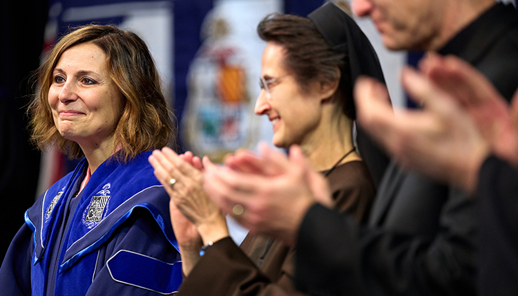 President Passerini smiling at her inauguration. President Passerini smiling at her inauguration.