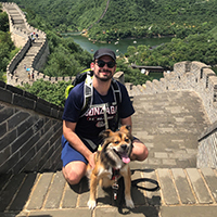 Peter and his dog pose on the Great Wall of China. Peter and his dog pose on the Great Wall of China.