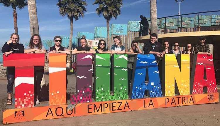 Gonzaga students pose at colorful Tijuana sign on the beach in Mexico Gonzaga students pose at colorful Tijuana sign on the beach in Mexico