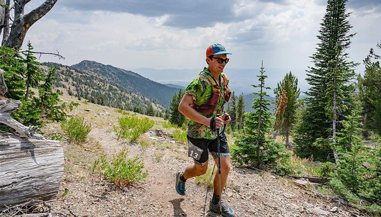 man running on mountain trail man running on mountain trail
