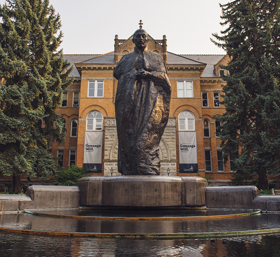 Statue of St. Ignatius with water in front