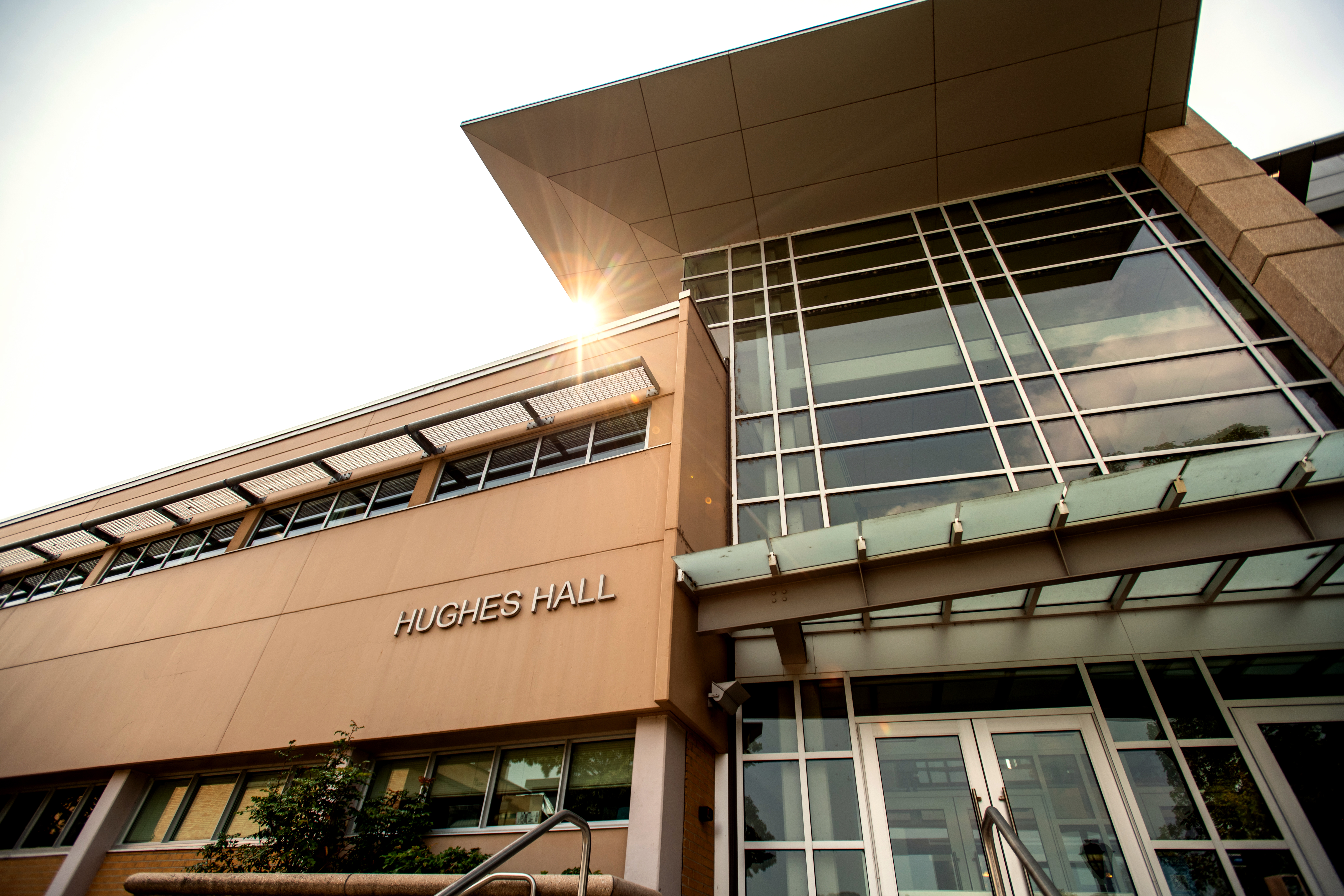 front view of Hughes Hall in summer