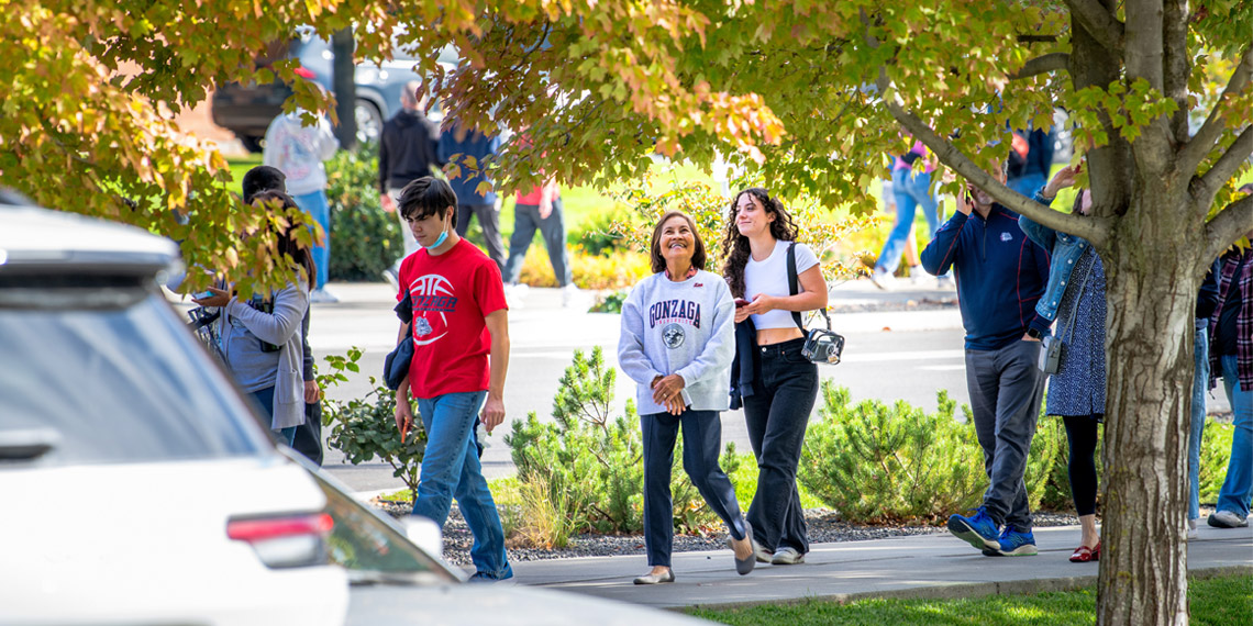 Students and families walking through campus during Gonzaga University's annual Fall Family Weekend.